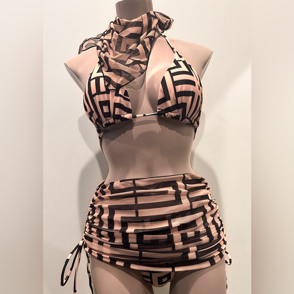 Size S great condition.  4 pieces swimsuit blk/tan.  scarf,skirt,top and bottom